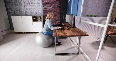 Correct Posture At Desk In Office Stock Photos