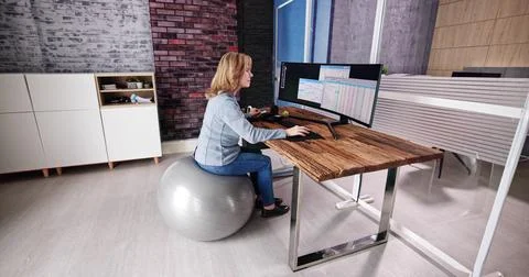 Correct Posture At Desk In Office Stock Photos