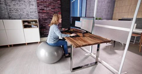 Correct Posture At Desk In Office Stock Photos