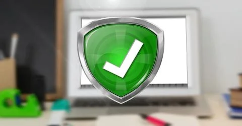 Correct tick security protection shield and computer in background Stock Photos