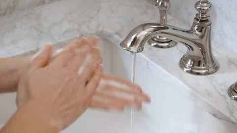 The correct way to wash hands to prevent coronavirus spread.  Stock Footage 106183014