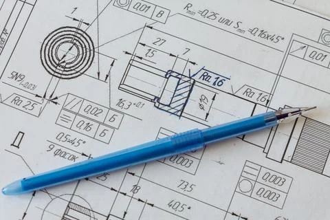 Correcting a drawing with a ballpoint pen. Engineering concept Stock Photos