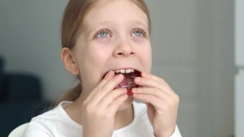 Correcting a girl's bite using a removable orthodontic appliance. plate for teet Stock Footage 256916507