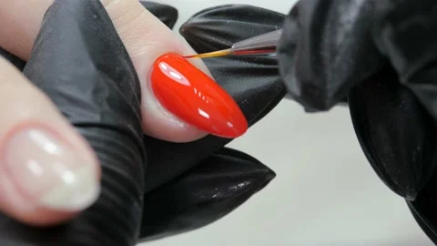 Correction of the lacquer contour on the nail with a thin brush. Stock Footage 221513221