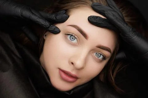 Correction of permanent eyebrow makeup, second PMU procedure Stock Photos