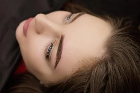 Correction of permanent eyebrow makeup, second PMU procedure Stock Photos