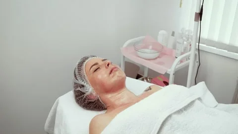 Correction procedure and anti-wrinkle treatment for beautiful woman relaxing in Stock Footage 309019872