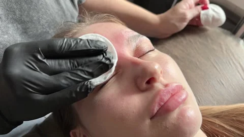 Correction of a shape of eyebrows with hot wax. Brow master applying wax on the Stock Footage 282697593