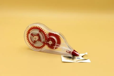Correction tape on a brown background with text in English that says correcte Stock Photos
