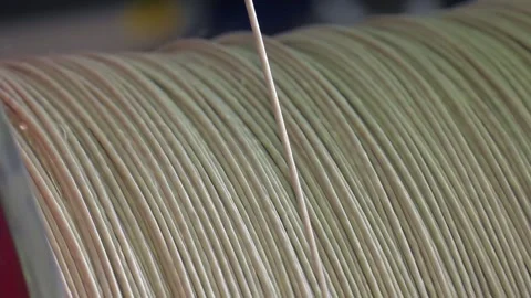 Correctly wind the cable on the drum. Industrial cable production. Stock Footage 100406028