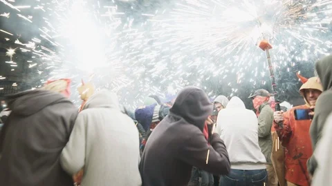 Correfoc devils dancing in the crowd covering everyone with fire Barcelona Spain Video stock 100387064