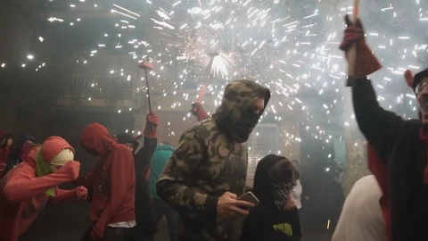 Correfoc devils dancing in fire in the streets of Spain Stock Footage 100376903