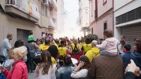Correfoc drums being played as the fireworks go off in the distance Stock Footage 100389978
