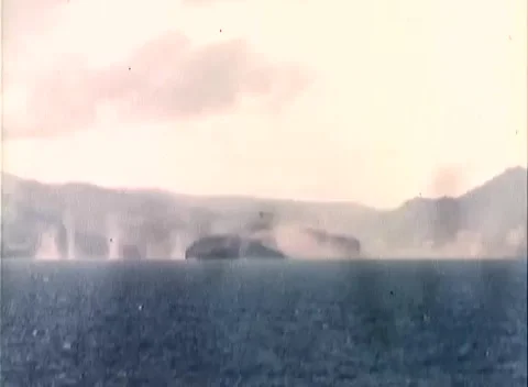 CORREGIDOR - 1945: Naval gunfire - Shell Splashes along Island Shore Video stock 343786071