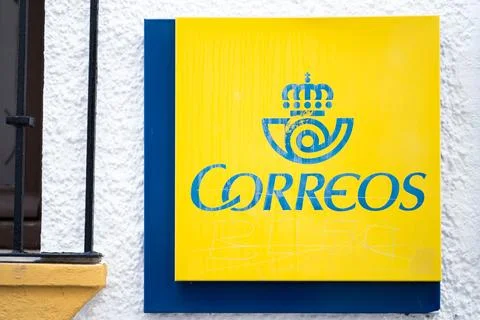 Correos logo on the wall. Stock Photos
