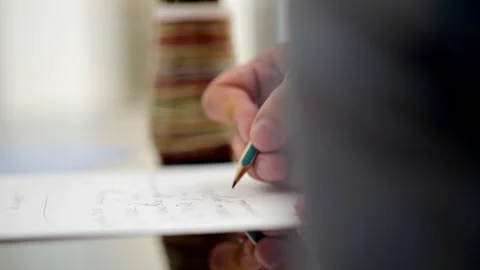 Correspondence. Taking notes. Close-up of a hand drawing letters on a white Video stock 206381258
