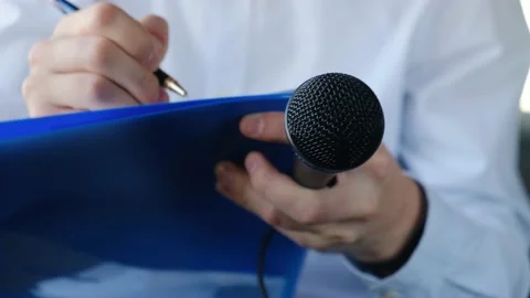 Correspondent or journalist interviewing and writing something down in notebook 動画素材 146640360
