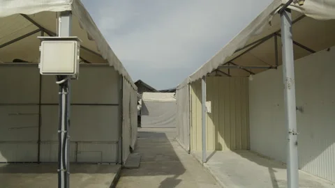 Corridor between white event tents Stock Footage 335732223
