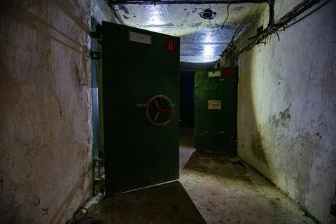 Corridor with blast proof armored doors in the military bunker Stock Photos