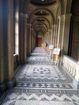 Corridor of the castle with easels along interior view vertical Stock Photos