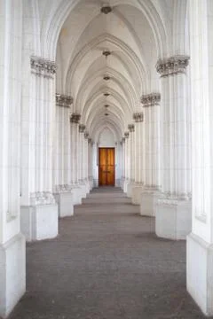 Corridor of columns in the church Stock Photos