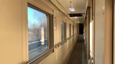 In the corridor of the compartment car of the train in motion, flashing winter Stock Footage 146474768