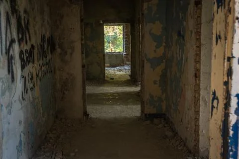 A corridor in an empty, neglected and abandoned building Foto stock