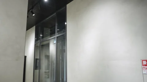 Corridor with fire alarm and ventilation grid on grey walls Stock Footage 330928502