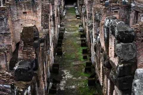 Corridor in the galleries under the central arena of the Colosseum in Rome Stock Photos