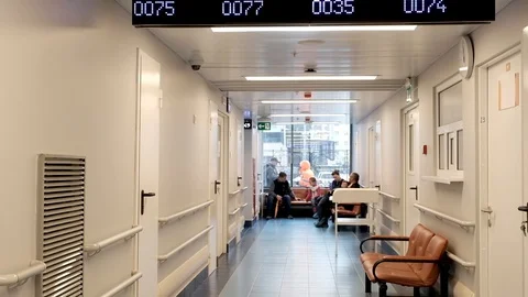 The corridor in the hospital with an electronic scoreboard queue. Stock Footage 95529604