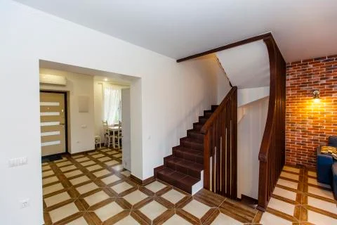 Corridor, kitchen and stairs to the second floor in the cottage Stock Photos