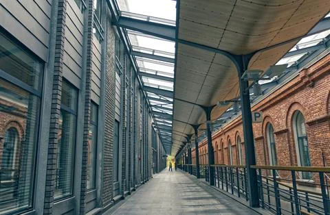 Corridor in a modern office complex connected to a post-factory building Stock Photos