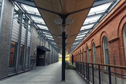 Corridor in a modern office complex connected to a post-factory building Stock Photos