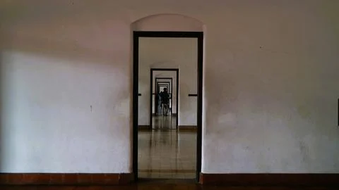 Corridor with multiple black-framed doorways Stock Photos