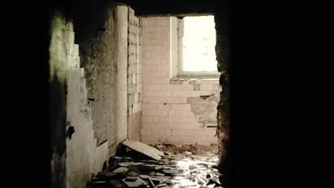 Corridor of an old abandoned house. A light shines through the window Stock Footage 131887588