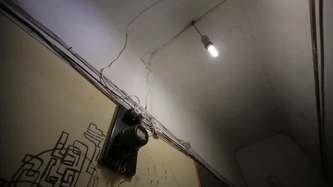 Corridor in an old Soviet house, a light bulb and an electric counter Stock Footage 93849333