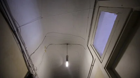 Corridor in an old Soviet house, a light bulb and an electric counter Stock Footage 93849427