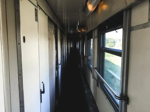 Corridor of a passenger train carriage Stock Photos