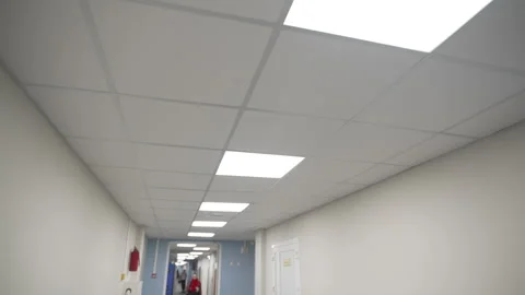 Corridor with seats and bright led lights in modern hospital Vídeo Stock 313830185