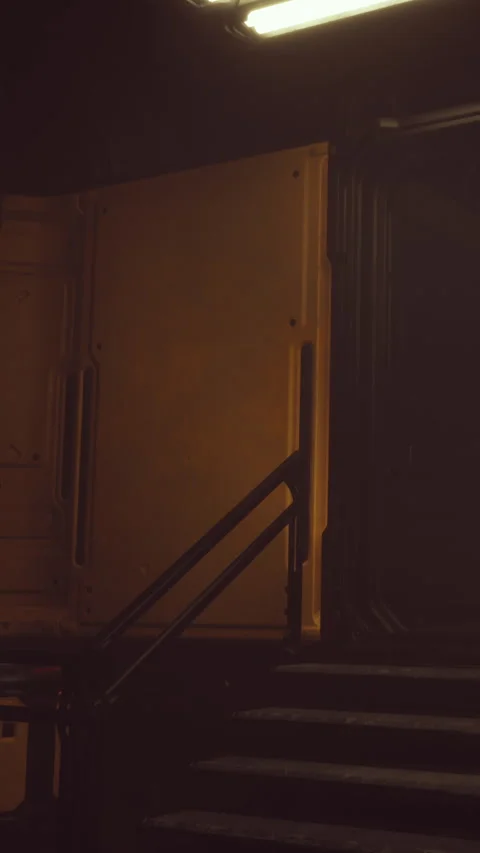 A corridor shows a wall with warm lighting and stairs on one side Stock Footage 337972774
