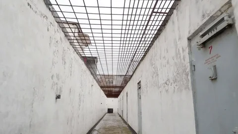 Corridor of a walking yard with doors in the correctional colony, jail in Russia 스톡 동영상 81582266