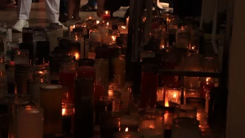A corridor of white burning candles in a Catholic church Stock Footage 87038906