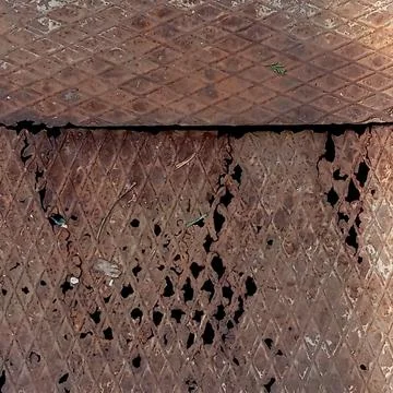 Corroded Rusty Metal Surface Texture with Holes Fotos de archivo