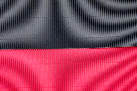 Corrugated application paper background. Red and black color Stock Photos