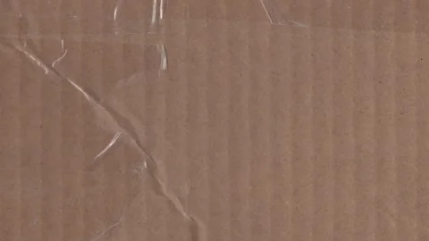 Corrugated cardboard texture with tape, simple background for packaging Stock Footage 328135875