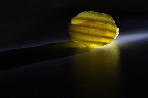 Corrugated chips in on a black background Stock Photos