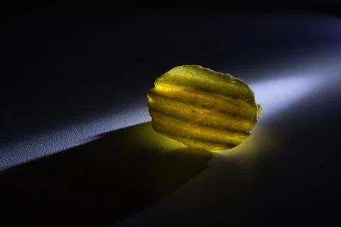 Corrugated chips in on a black background Stock Photos