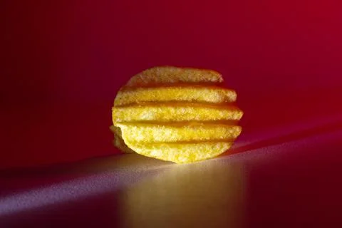 Corrugated chips in red light on a background Stock Photos