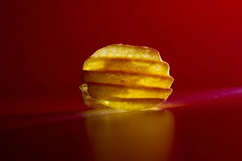 Corrugated chips in red light on a background Stock Photos
