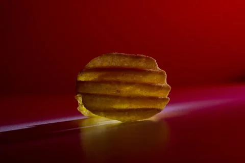 Corrugated chips in red light on a background Stock Photos